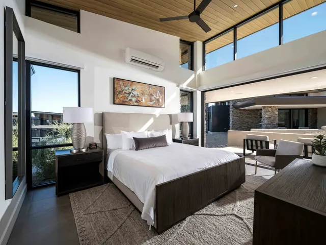 King suite with a wall of glass to its terrace
