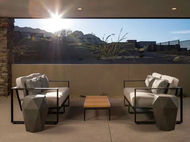 Terrace chairs facing the desert at sunrise