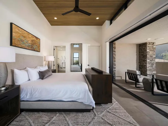 King bedroom with a sliding glass door to the terrace