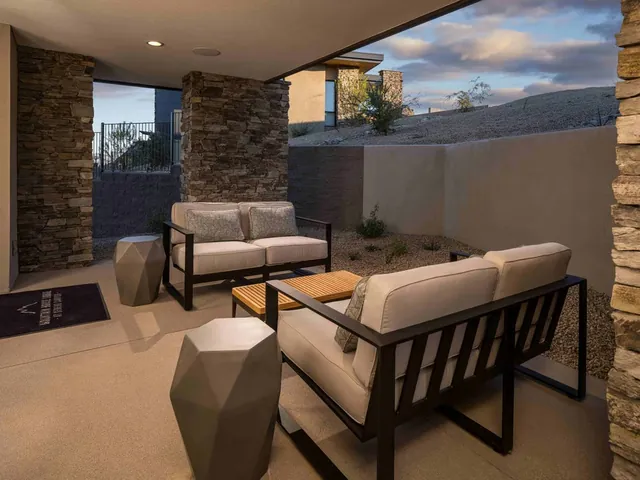 Terrace chairs under the stone columns